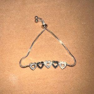 Silver tone Lariat Bracelet with black and clear pave crystal hearts